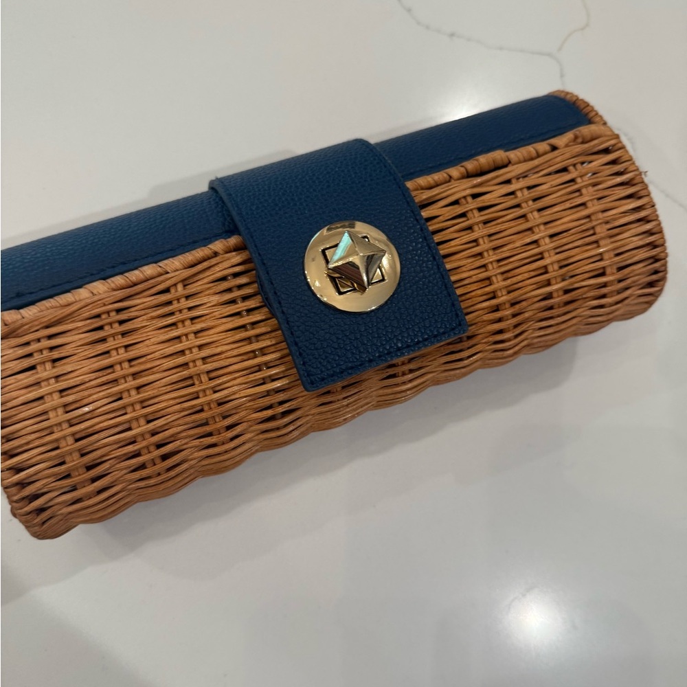 Navy leather and brown wicker Clutch with Gold Accent like new. Never used